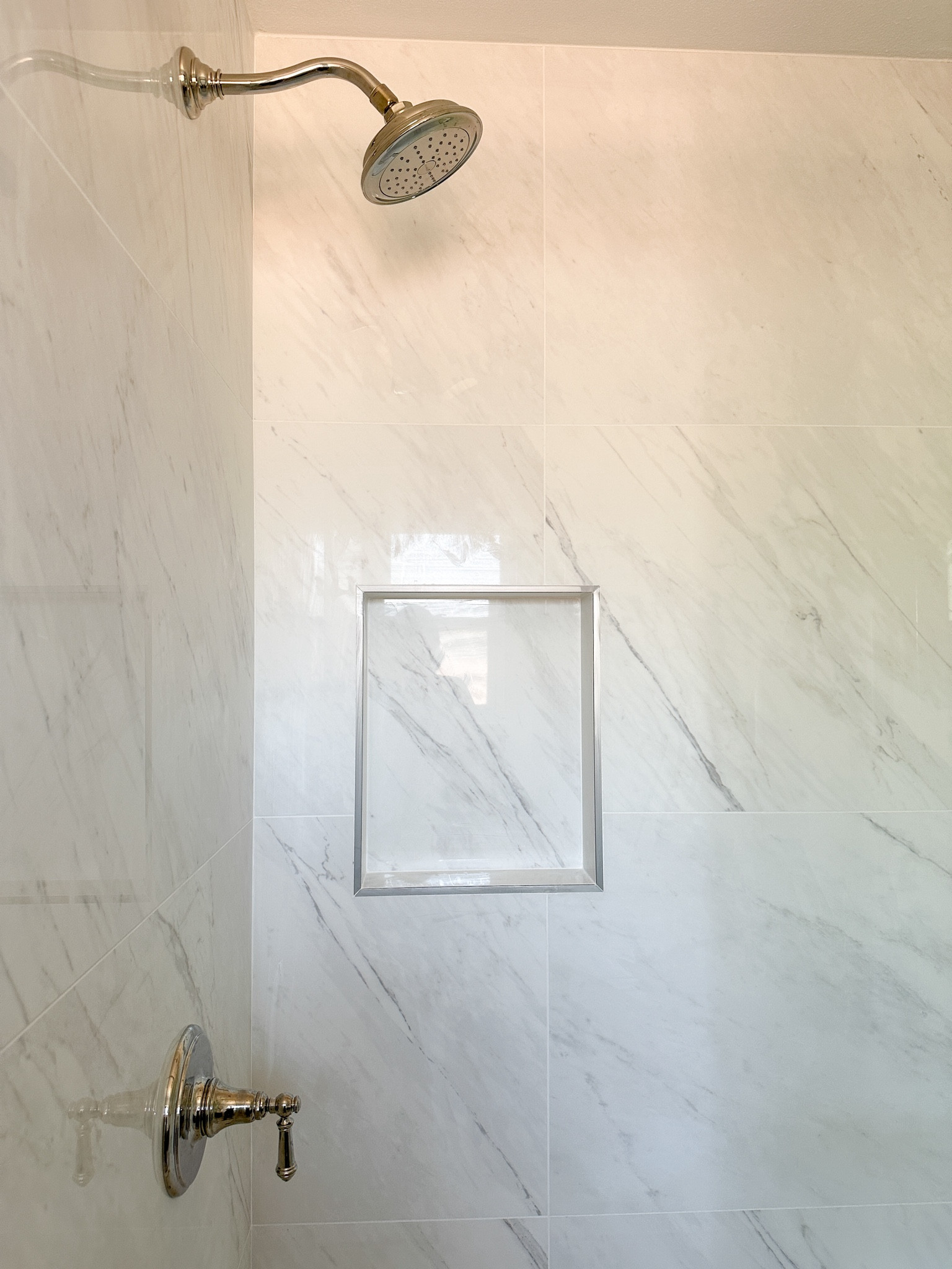 Porcelain shower tile, polished nickel shower fixtures