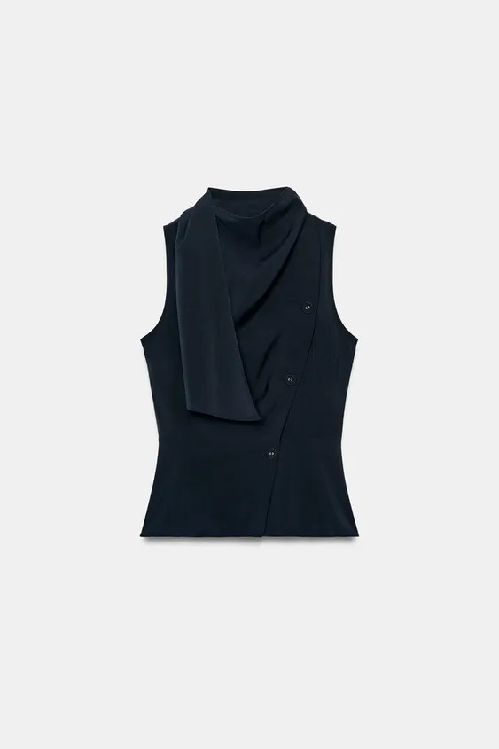 Model height: 180 cmSleeveless top with a fluid neckline and scarf-effect fabric. Flared hem. Wra... | Zara UK