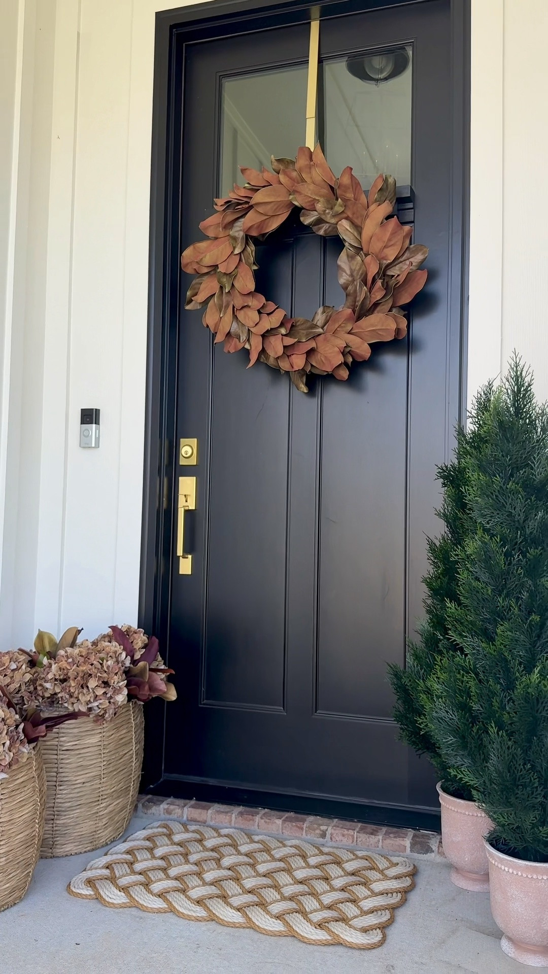 Our fall front porch 🍂 The magnolia wreath might be my favorite part — paired with dried hydrangeas, a rope doormat, and cedar topiaries, it makes the whole entrance feel warm and welcoming for the season. Linking everything we used to get the look here!

#LTKSaleAlert #LTKHome #LTKSeasonal