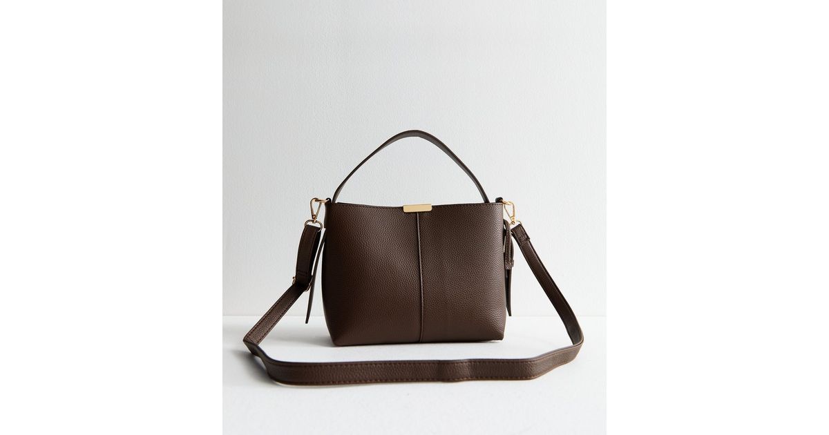 Brown Leather Look Buckle Strap Bucket Bag
						
						Add to Saved Items
						Remove from Save... | New Look (UK)