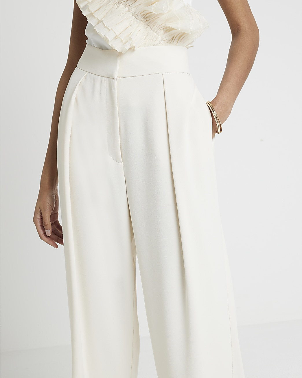Cream pleated wide leg trousers | River Island (UK & IE)