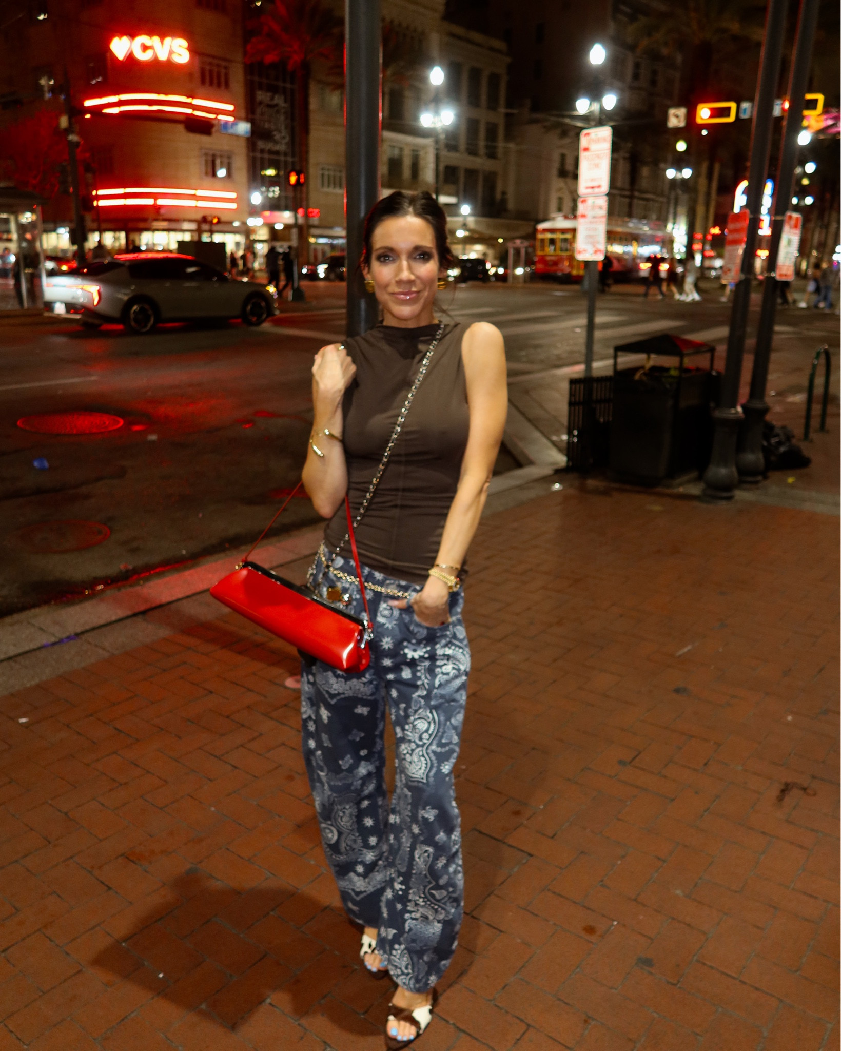 New Orleans nights! 

This would be such a great date night outfit! These bandana print jeans are everythiiiing! I paired them with this fitted brown top, and a pop of red with this clutch! 

#LTKootd #LTKTravel #LTKdayinmylife