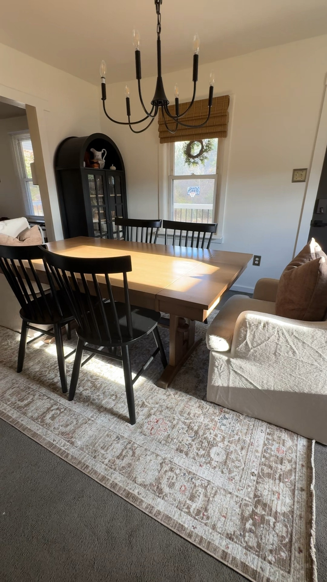 I wish I did this sooner!!
If you’re stuck with old carpet you can’t rip up yet, try layering an area rug over it.
It instantly warms up the space and makes the carpet way less noticeable.
Such a simple fix but it makes a big difference.

We rented this house for years before buying it, and we’re not ready to rip up the carpet just yet since we’ll eventually be doing a bigger renovation.
But for now, we’re updating this space in small ways to make it feel cozier for the holidays:

– Restained the original table (it was my grandparents’ 🥹)
– Added new chairs (the old ones were falling apart)
– Painted the walls a fresh white — HUGE change
– Swapped in a brighter light fixture
– Put up new blinds
– Added a china cabinet for storage + style

If you’re in that “not-quite-renovating yet” phase too, you can still make your space feel more like you.

#diningroom #diningroommakeover #oldhome #homeupdates #beforeandafter 

#LTKHome