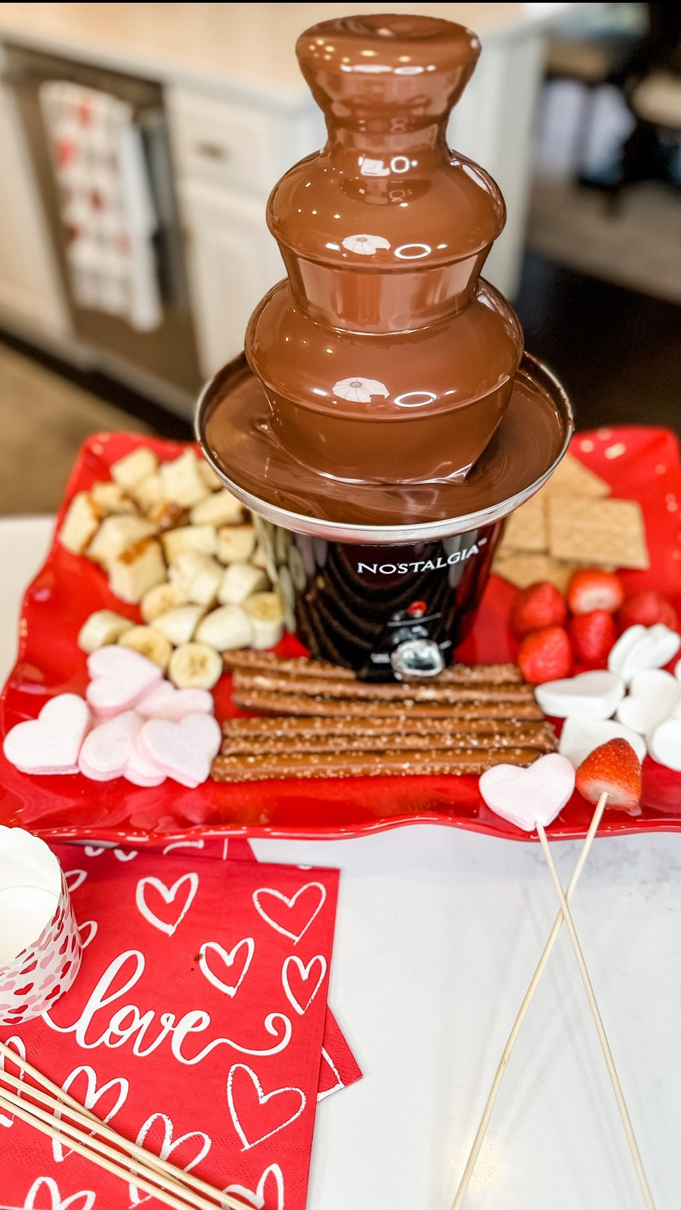 Chocolate Fountain Dessert Board is a cute and sweet dessert idea for your next get-together! 🍫✨ Delicious with fruits, pretzels, and marshmallows and more! Endless possibilities for dippers! What will you dip first? 😋 

Valentine’s Day Dessert
Valentine’s Fondue
Valentine’s Day Date 



You will need:
- 2 Bags of Semi-Sweet Chocolate Chips or Morsels
- 3/4 cup of vegetable oil 
- Choice of your favorite dippers- I used strawberries, bananas,marshmallows,pretzel rods, graham crackers and pound cake. 
- Plug in and pre-heat fountain 
- Mix and microwave chocolate or heat on a stovetop until nice and glassy smooth
- Transfer melted chocolate to your fountain base until your chocolate slowly circulates through the tiers
- Serve with skewers or you can use forks 
- Enjoy! 

#LTKHome #LTKGiftGuide #LTKParties