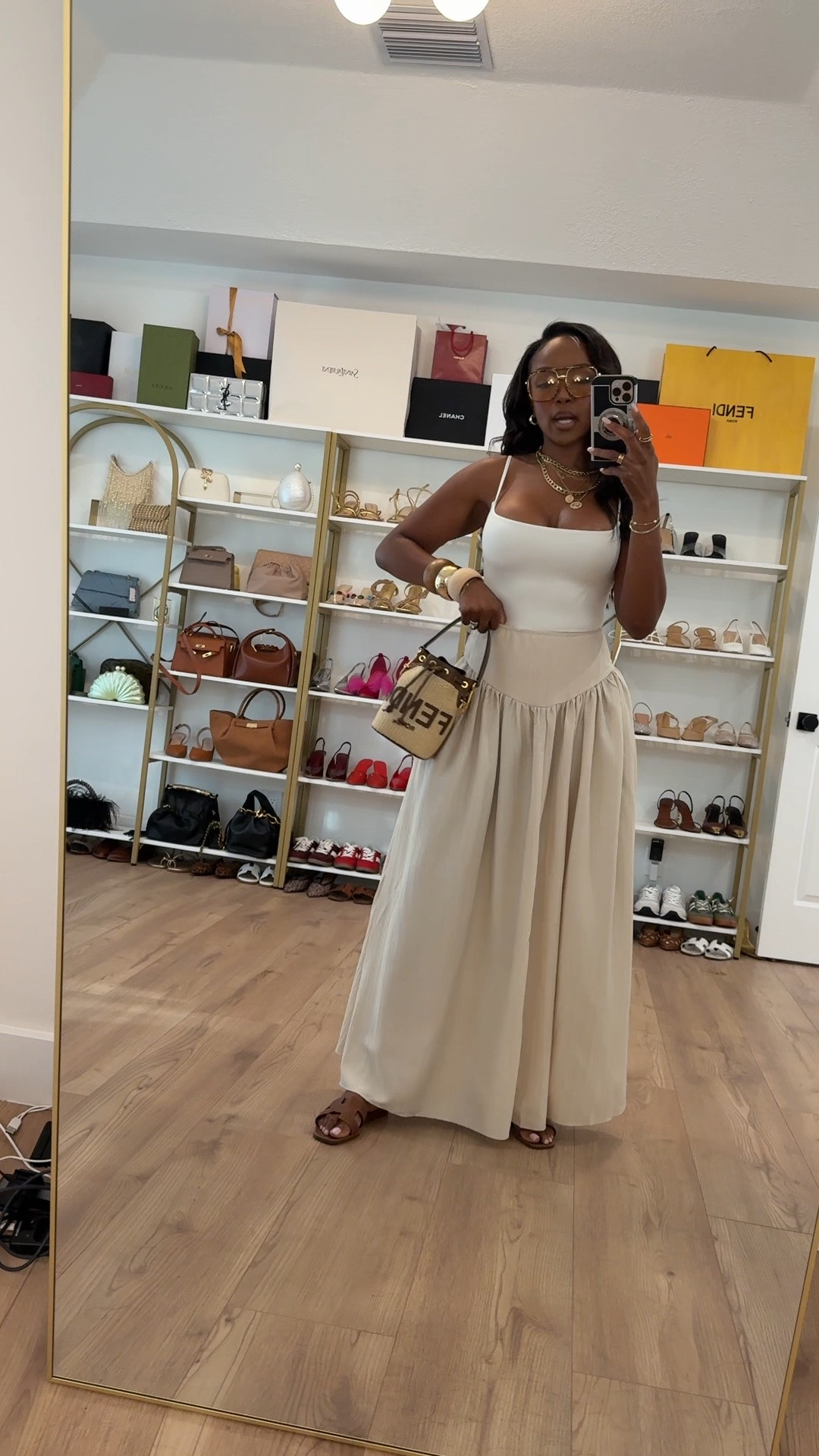 Hi Babes!

Okay this outfit is giving quiet luxury in the best way. The fitted white tank paired with this flowy neutral maxi skirt creates such an effortless, elevated silhouette that looks far more expensive than it is.

I love how the soft neutral palette, gold jewelry, and designer-inspired accessories make this feel timeless. It's feminine, comfortable, and one of those outfits you'll wear on repeat all season long.

Where to wear this:
• Resort vacations
• Brunch dates
• Coastal weekends
• Summer shopping days
• Casual dinner nights

Undergarments: Nude seamless bra and seamless thong recommended for the smoothest fit (linked).

Everything is linked below!

xx Kira | IG: KirasFashionFinds

34D - 27 - 40 • Size Small or 4