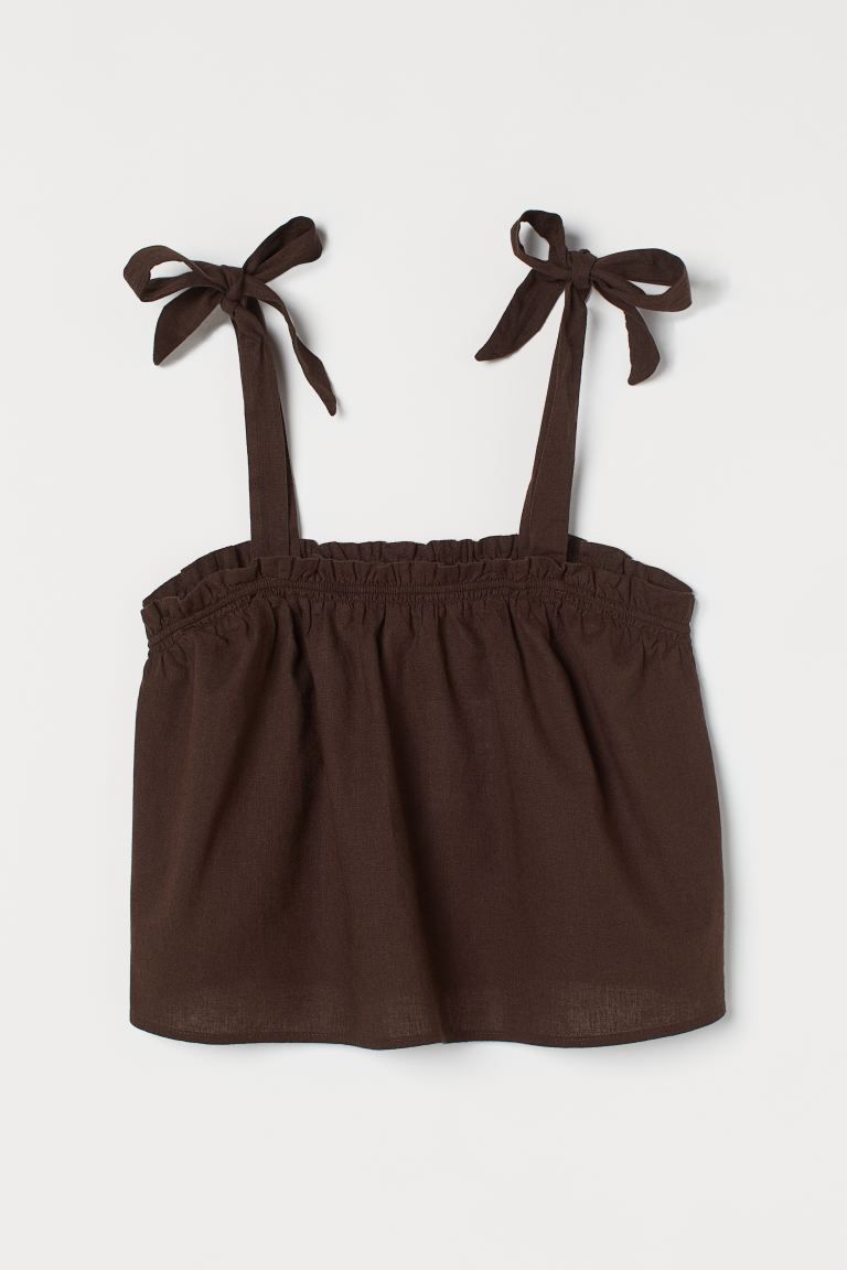Flared top in woven fabric with wide, tie-top shoulder straps. Smocking and ruffle trim at upper ... | H&M (US)