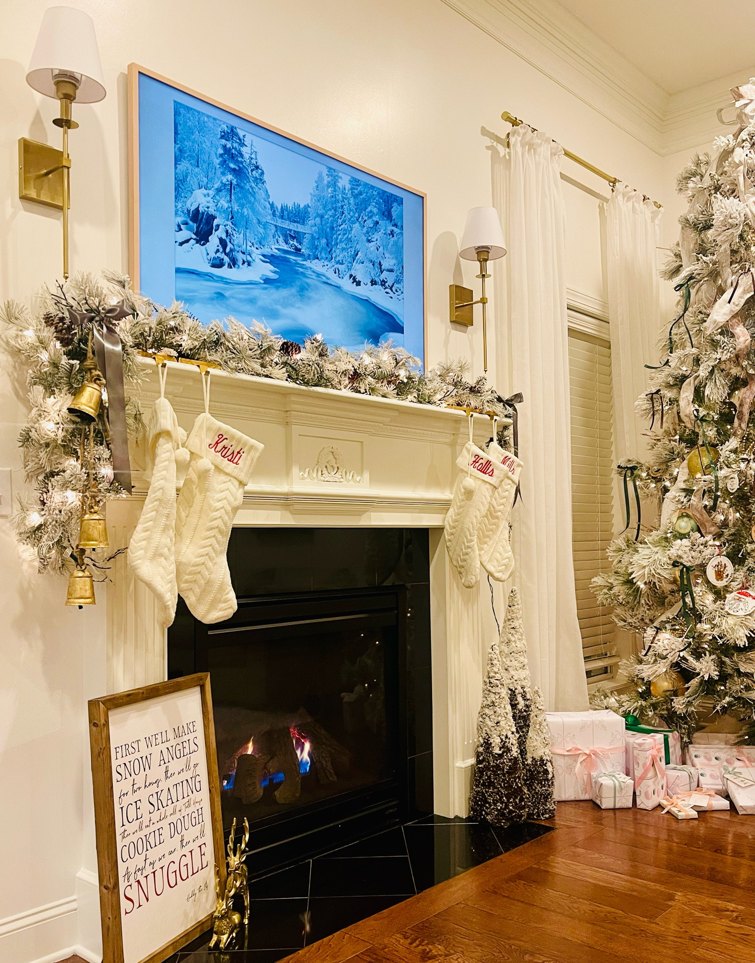 Christmas mantle with frame tv, Christmas bells, and flocked garland 

#LTKhome #LTKSeasonal #LTKHoliday