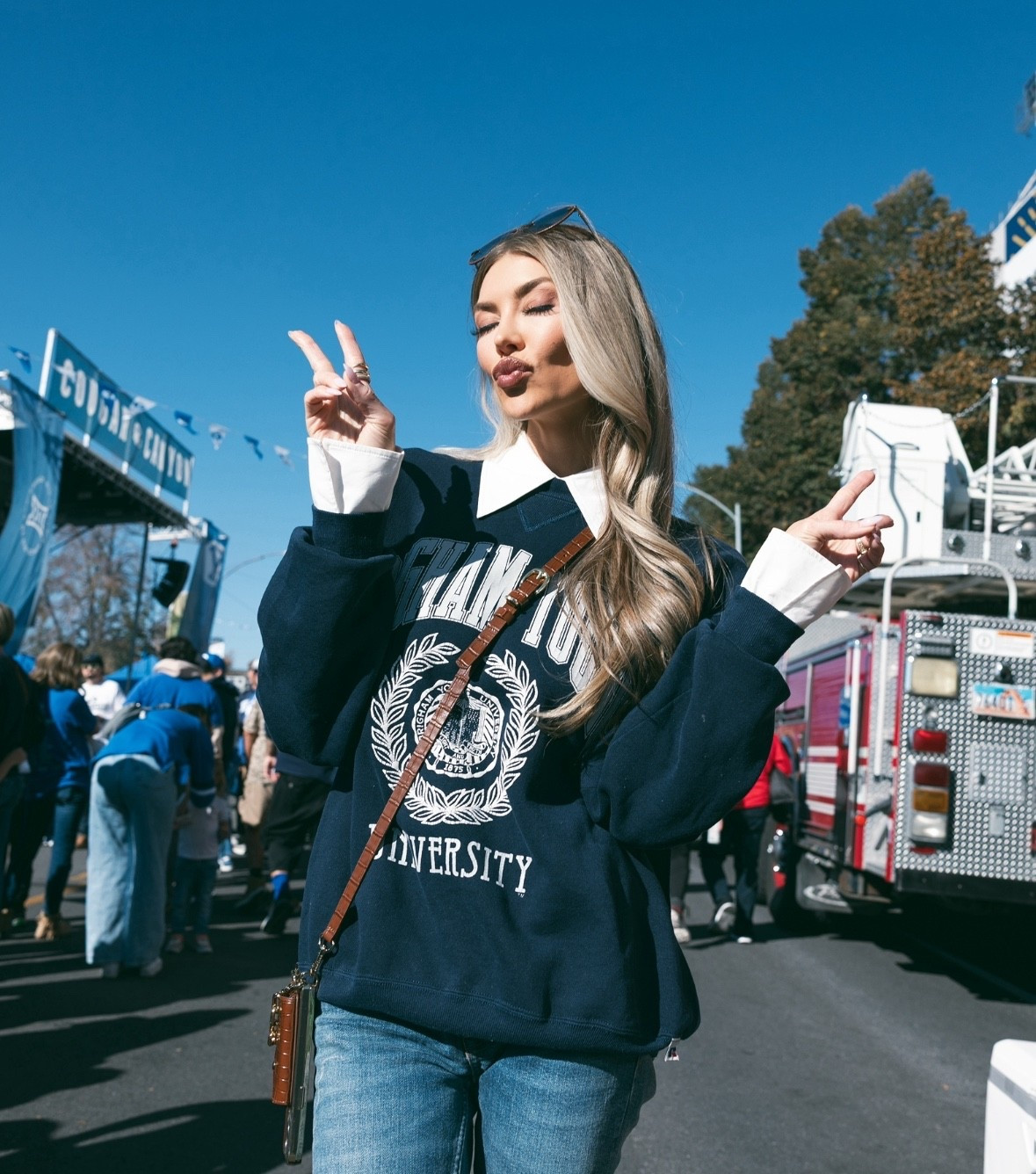 That’s a wrap on a great weekend in Provo! 💙🤍 BYU sweatshirt is my mom's from when she was in college, but I linked some similar collegiate vibes no matter your team. My collared shirt is by Ronny Kobo. It's actually genius because I got the look of the exaggerated collar and cuffs but the mesh made it not crunchy or bulky under my sweatshirt. My sunglasses are Chloe, linked similar. My jeans are Polo Ralph Lauren, linked exact and similar. My tall black leather cowboy boots are Oasis Society, linked similar. GO COUGS!! 

#LTKStyleTip #LTKSeasonal #LTKFindsUnder100