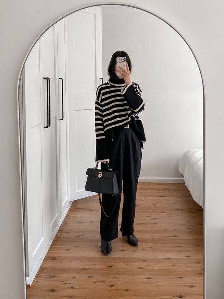 Oversized knit in size s, trousers in size S 🖤 all black outfit with stripe sweater and pleat front pants 

#LTKSeasonal #LTKaustralia