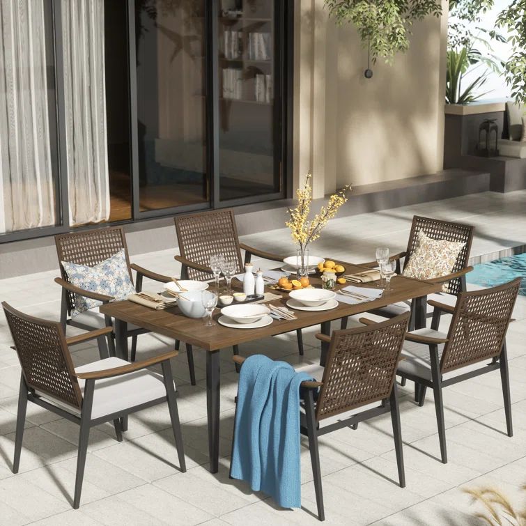Arthetta 7 Piece Outdoor Dining Table Set with 6 Rattan Wicker Chairs with Cushions | Wayfair North America