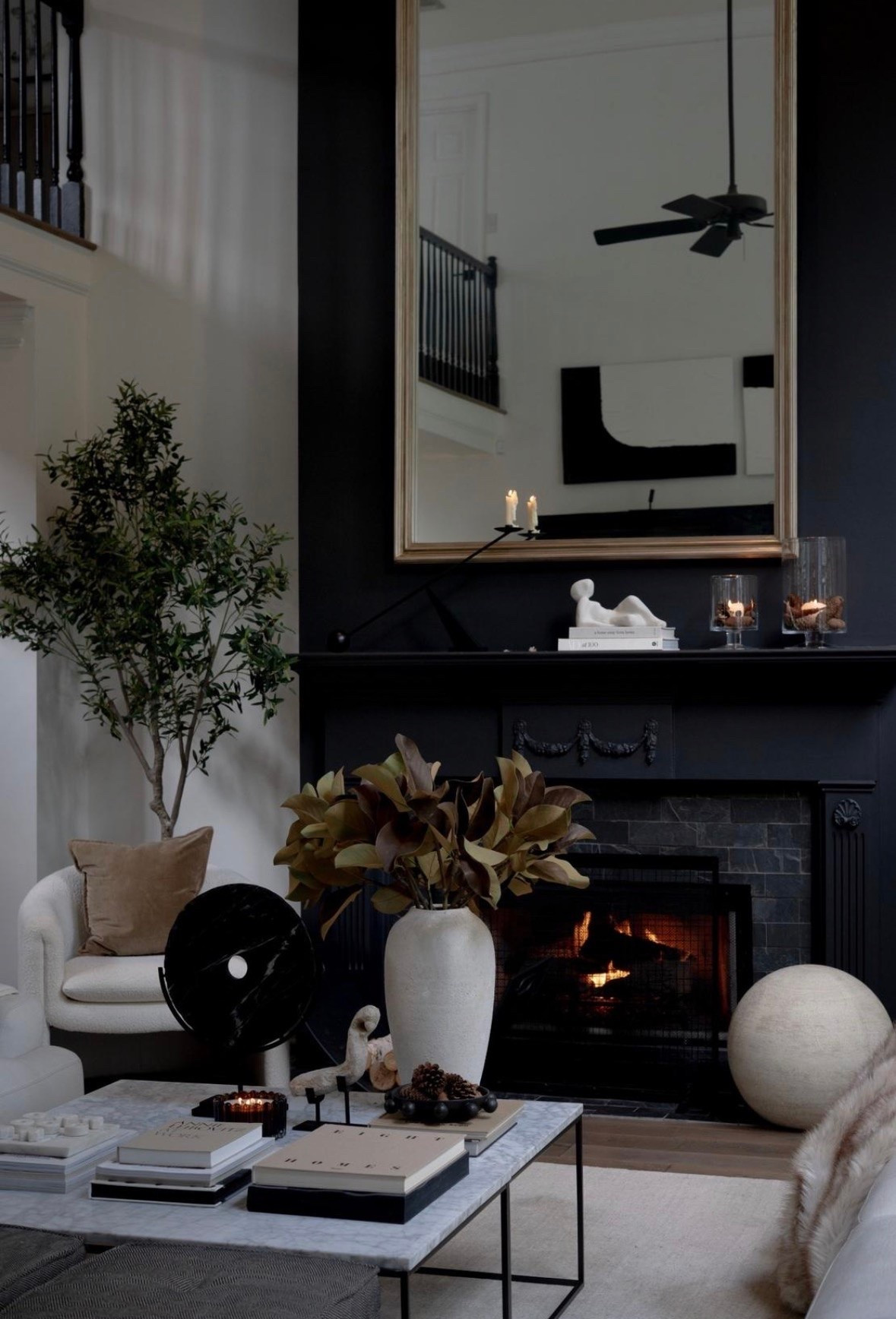 Lately I’ve been musing on what actually makes a home feel cozy.

I don’t think it’s a particular color palette or decorating style. It’s the glow of a fire at the end of the day. A few candles flickering on the mantel. Branches clipped from outside and dropped into a favorite vase. Books stacked on the coffee table that have actually been read and collected over time.

Maybe that’s why I love this room so much. It feels dramatic and beautiful, but also like somewhere you’d curl up and stay awhile.

As we head into fall, I’m craving less “decorating for the season” and more creating moments that feel like the season. #HouseOfValentina

#LTKSeasonal #LTKHome #LTKstorytime