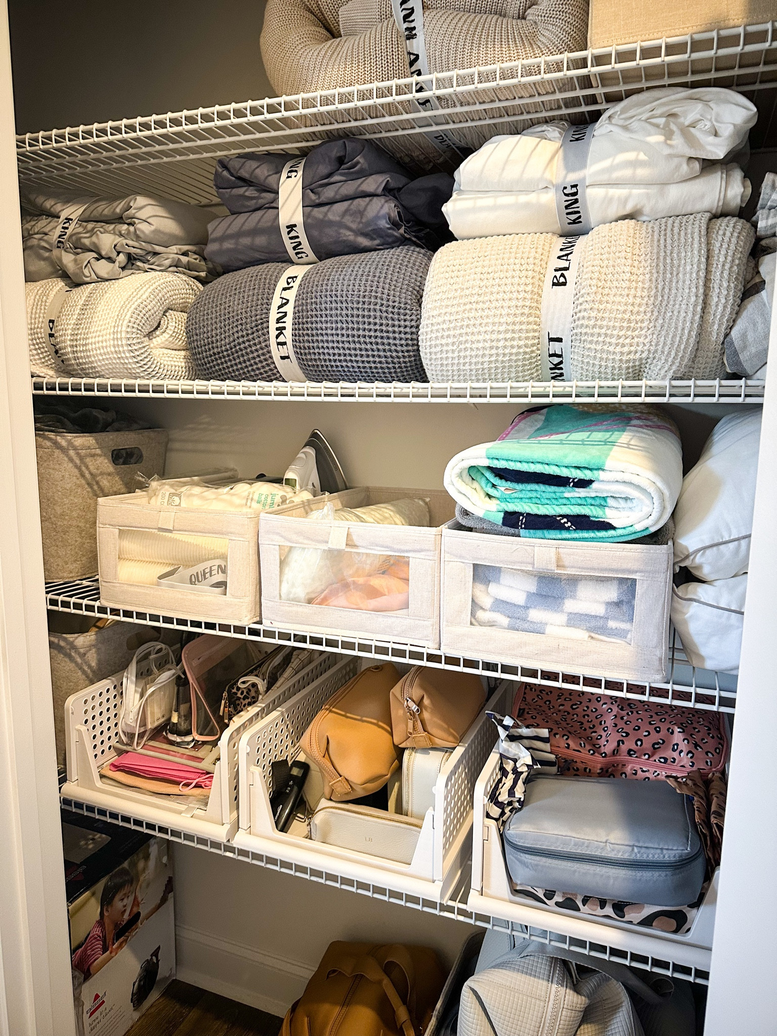 There’s something so therapeutic about purging and reorganizing closets. This storage closet in our hallway became a bit of a dumping ground for all the odds and ends upstairs. It had things stored in it that I hadn’t touched in years, so it was *time* to empty it all out, make a huge donation/trash pile, and only return the things that we actually use and need. The way that I can keep something organized after initially setting it up is making sure that I have a home for everything. Containers of all kinds are my best friend in this scenario because it means there’s a spot to put anything new that comes in. And if there isn’t a spot, then something old may have to go!