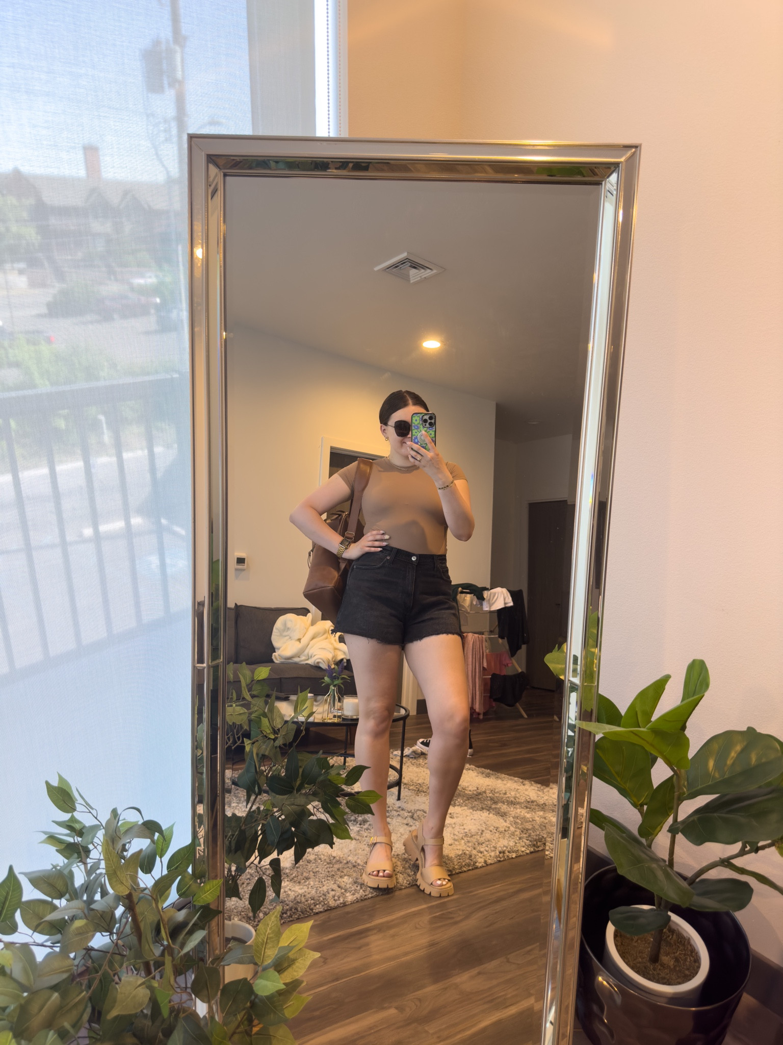 Neutral spring to summer outfit! Featuring the best denim shorts and a fitted bodysuit. 

I’m wearing a M top, size 31 shorts and size 9 sandals

#LTKSeasonal #LTKunder100 #LTKstyletip