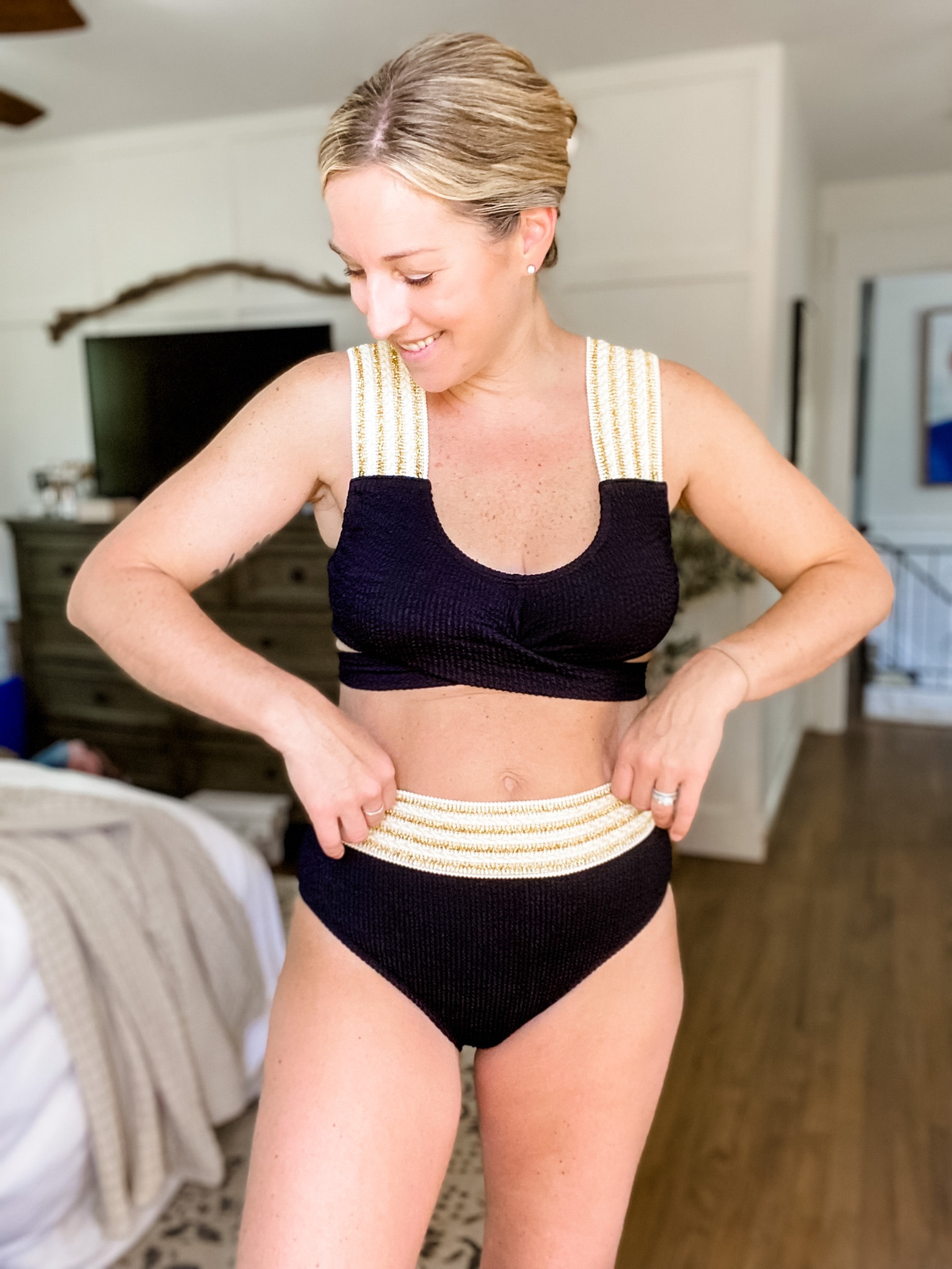 This bikini is soft and stretchy and oh so comfortable! Fits tts. Black and metallic. Wrap bikini  

#LTKSeasonal #LTKunder50 #LTKswim