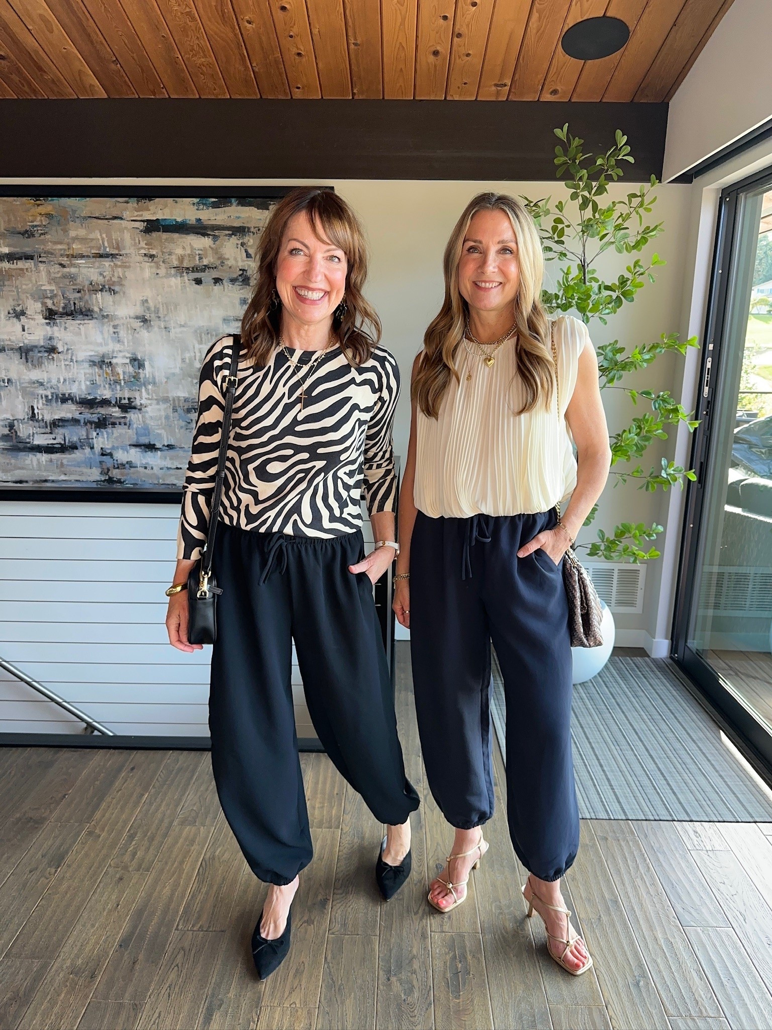 I’m a definite “yes” for these viral @Aritzia balloon pants! Julie was a “maybe” at first, but after styling them 3 ways, she’s a fan!!👌🏻
It’s fun to have a pant you can dress up or down, and this crepette material refuses to wrinkle. 
So comfy, too! Ours are black and navy, but they come in several colors. Are you a fan of this trend? 

Balloon pants, zebra print, @Spanx , quarter zip top, date night outfit, bubble top, suede jacket, suede flats, @Quince bag, cardigan, @Melie Bianco bag