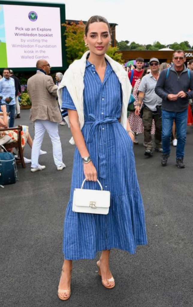 Chic summer outfit with a blue striped midi shirt dress, lightweight sweater draped over the shoulders, and a structured white handbag for an elevated everyday look.
Style tip: use a belted shirt dress to define your waist and create shape, layer a sweater over your shoulders for a polished, effortless touch, and stick to classic accessories like neutral heels and a structured bag to achieve a timeless, put-together outfit. 

 #LTKootd