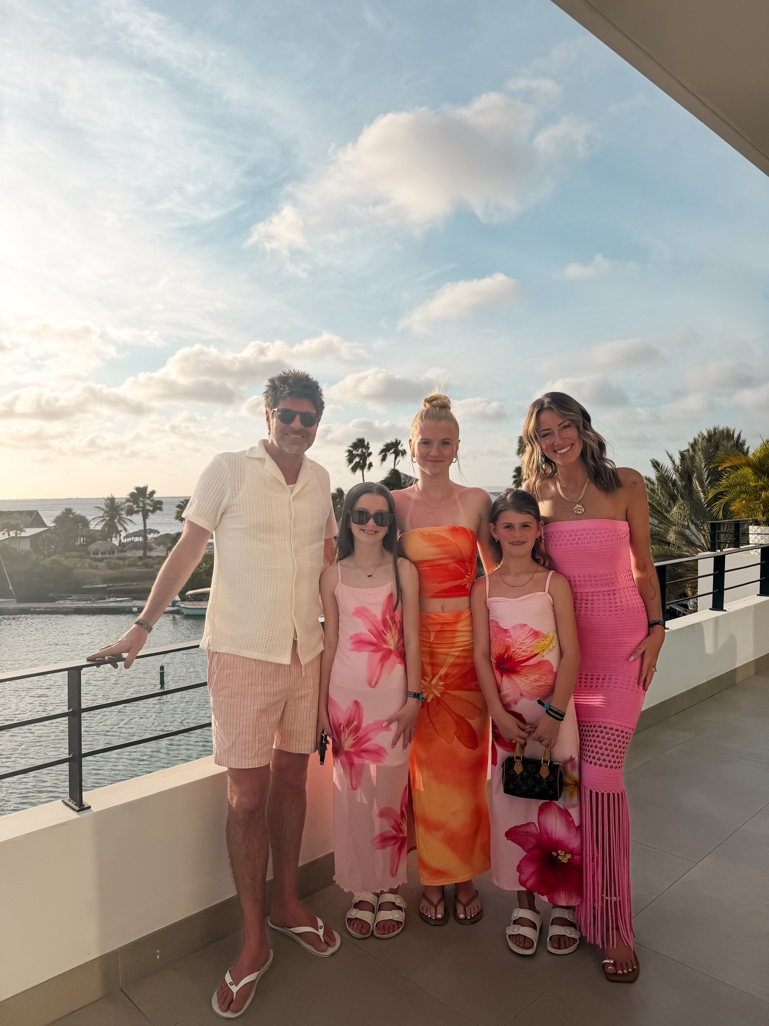 Family photo before dinner on vacation
Tropical summer dresses for girls and tweens 
Resort dinner date 