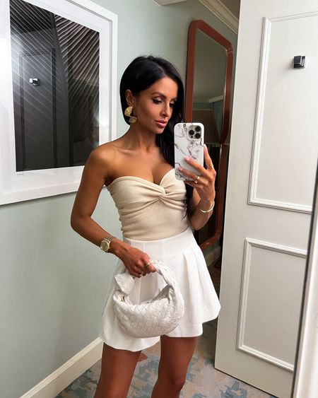 Vacation outfit ideas / affordable spring break outfit 
Amazon knit strapless top wearing an XS
Revolve white shorts wearing an XXS
Amazon earrings 



#LTKunder100 #LTKstyletip #LTKtravel