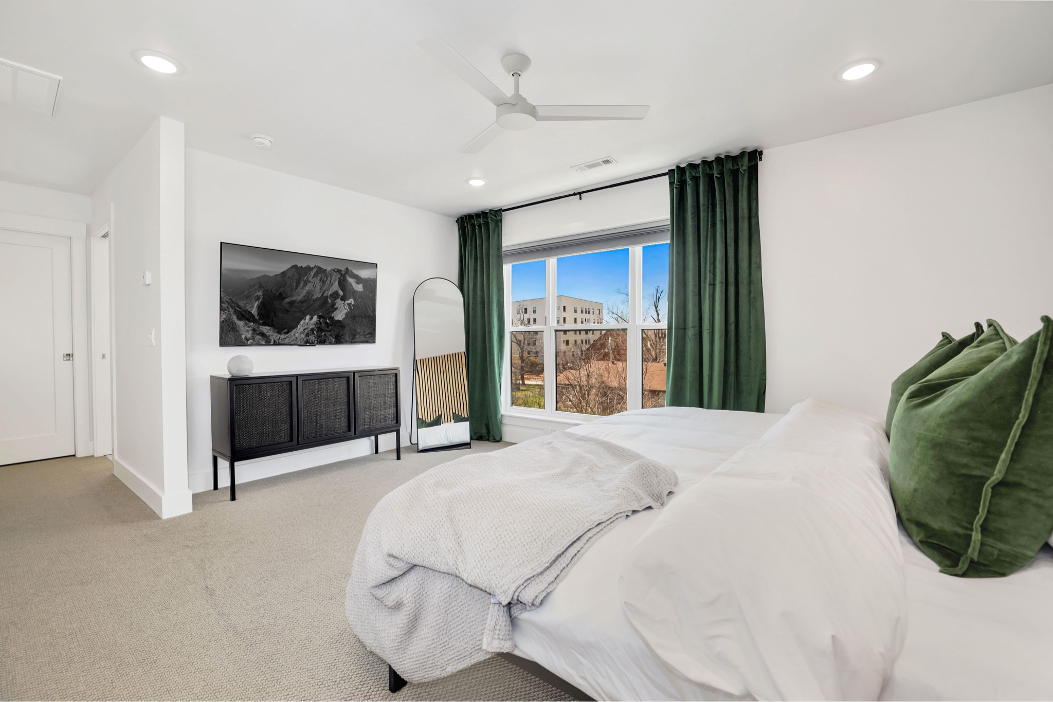 The ceilings drop to 8ft in this bedroom so hanging the curtains from the ceiling helps to make it feel more open. It gives some drama and illusion the ceiling is a little higher and the windows appear larger. The sleek sideboard under the tv has texture on the front doors and provides great storage to the room! Would also be great in a living room or entryway space. It’s quality and worth the time to put it together which I recommend two people for unless you’re handy - which I am not. :)

Home decor, bedroom, entryway table, design tips, tv cabinet, storage space, organization 

#LTKhome #LTKstyletip