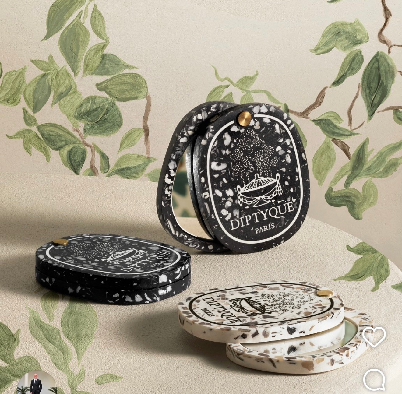 Dyptique
Shell Pocket Mirror

Oyster-shell fragments create contrasting patterns on a black pocket mirror in the shape of Diptyque's iconic oval.
Molded and polished to expose the natural iridescence of marine terrazzo within a dark mineral base, each piece is singular. Designed as an artful companion for les Rituels de Soin

#LTKTravel #LTKWorkwear #LTKootd
