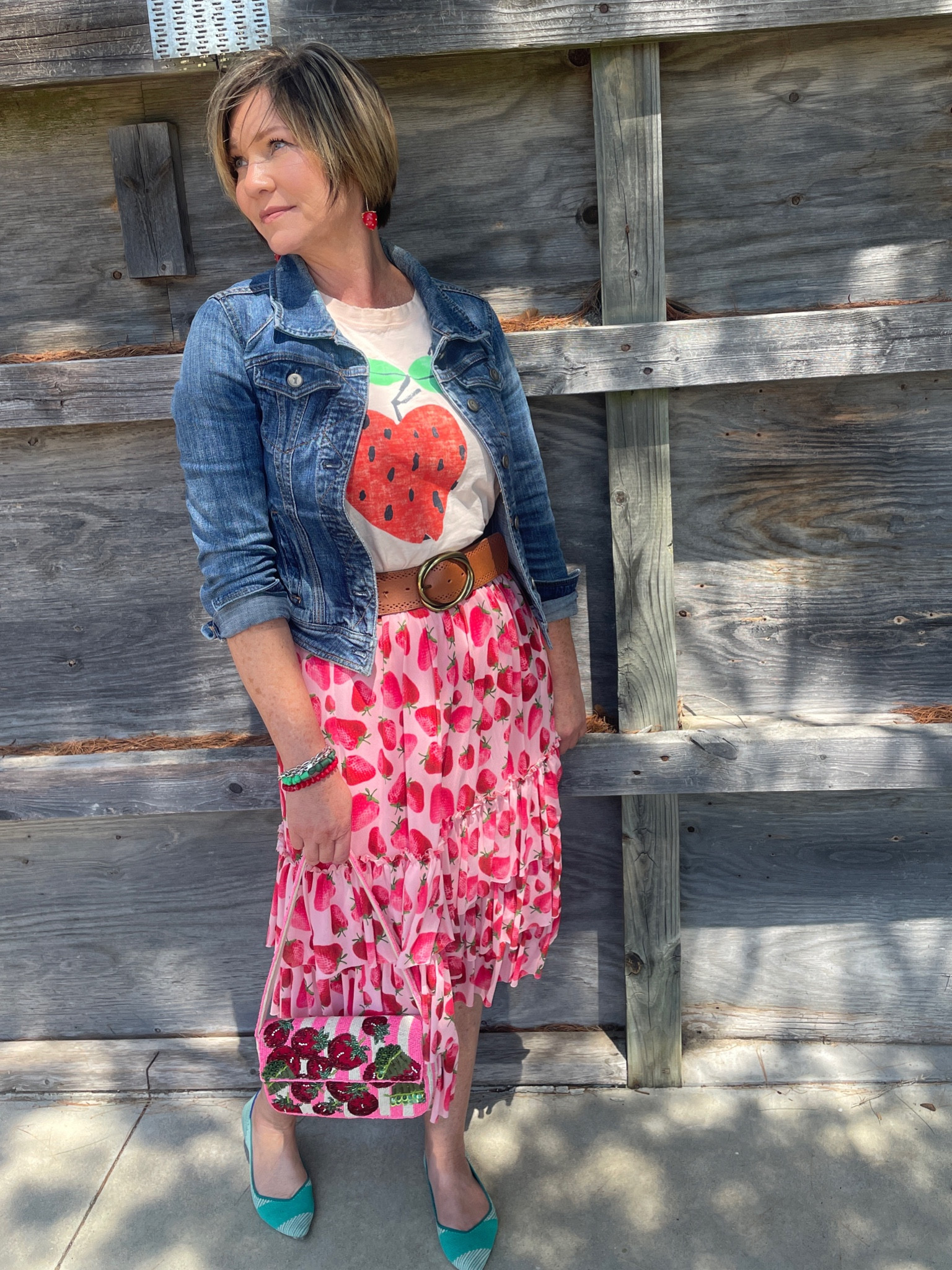I love a strawberry themed shirt and skirt and a classic jean jacket 
Addie a beaded bag and you’re good to go! #LTKSummerEdit 

#LTKSeasonal #LTKFindsUnder50