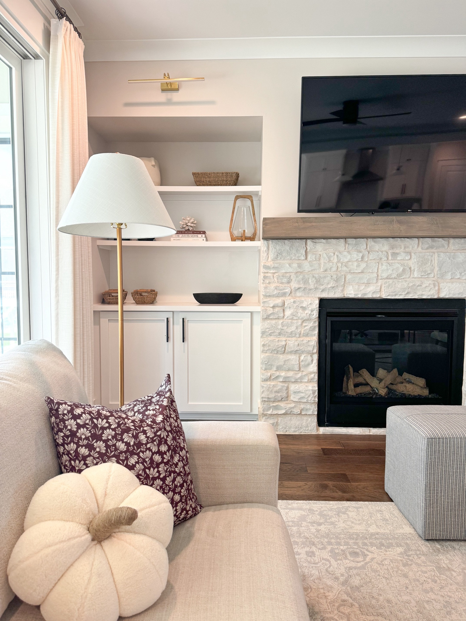 Fall Views around my home 

Fall decor, fall pillows, modern organic living room, transitional living room, white sofa, floor lamp, picture lights, ottomans, 

#LTKSeasonal #LTKHome #LTKStyleTip