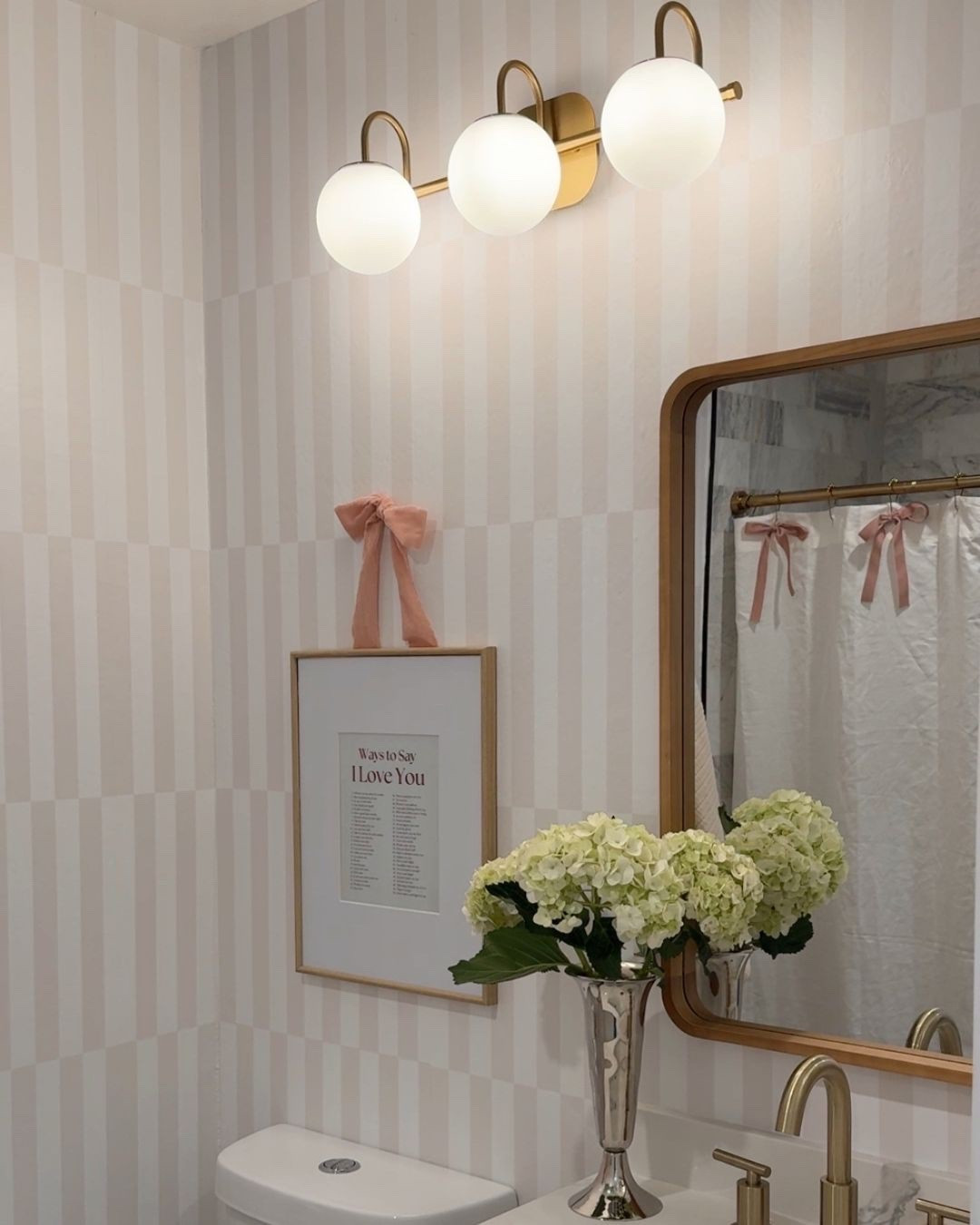 Girls bathroom decor, girly bathroom, striped wallpaper, bathroom light fixture 


#LTKHome #LTKFindsUnder50 #LTKKids