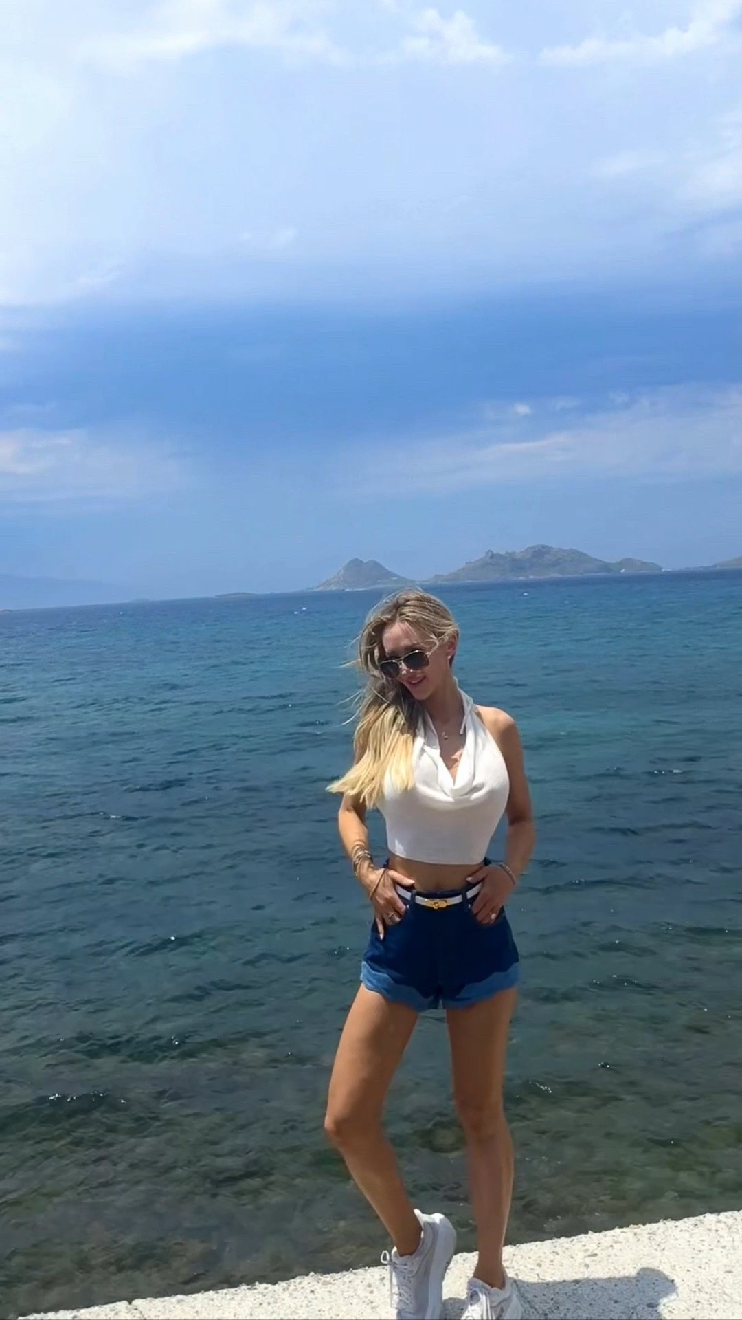 Perfect casual sightseeing outfit! We took a Vespa around Bodrum and through the hills. Stopped for some photos! 

Love these ruffle hem jean shorts, they are perfect for summer vacation. Retrofete and linked similar ruffle hem denim shorts from Amazon. Wore with a white halter neck backless cowl neck top. Also wore these shorts with a cotton white tee that I’ll link. 
Linking an Amazon dupe for the Hermes Kelly belt!

Shorts size 24, good for a lose fit but likely 23 would have been perfect. 
Top XS

#LTKootd #LTKTravel #LTKdayinmylife