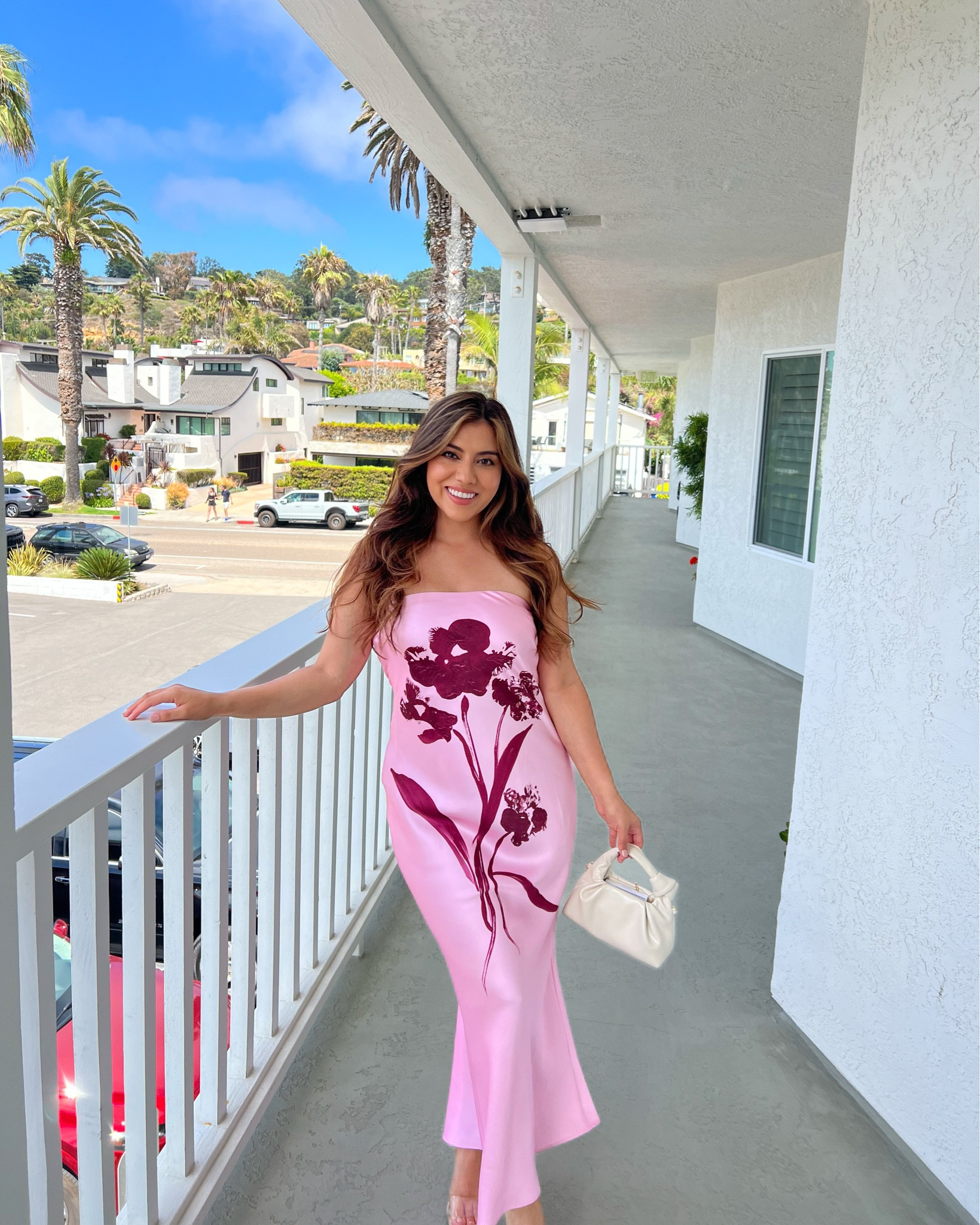 This wedding guest pink floral strapless dress is a total summer standout—elegant, feminine, and perfect for a coastal brunch or vacation dinner. The bold floral print adds a playful statement while the satin-like finish gives it a luxe, polished feel. Paired with a chic mini handbag and strappy heels, this look is giving effortless resort glam. #anthropolgie #FloralDress #VacationLook #BrunchOutfit #SummerOOTD #StraplessDress #ResortStyle #LTKSummer #CoastalVibes #LTKFinds

#LTKTravel #LTKWedding #LTKSeasonal