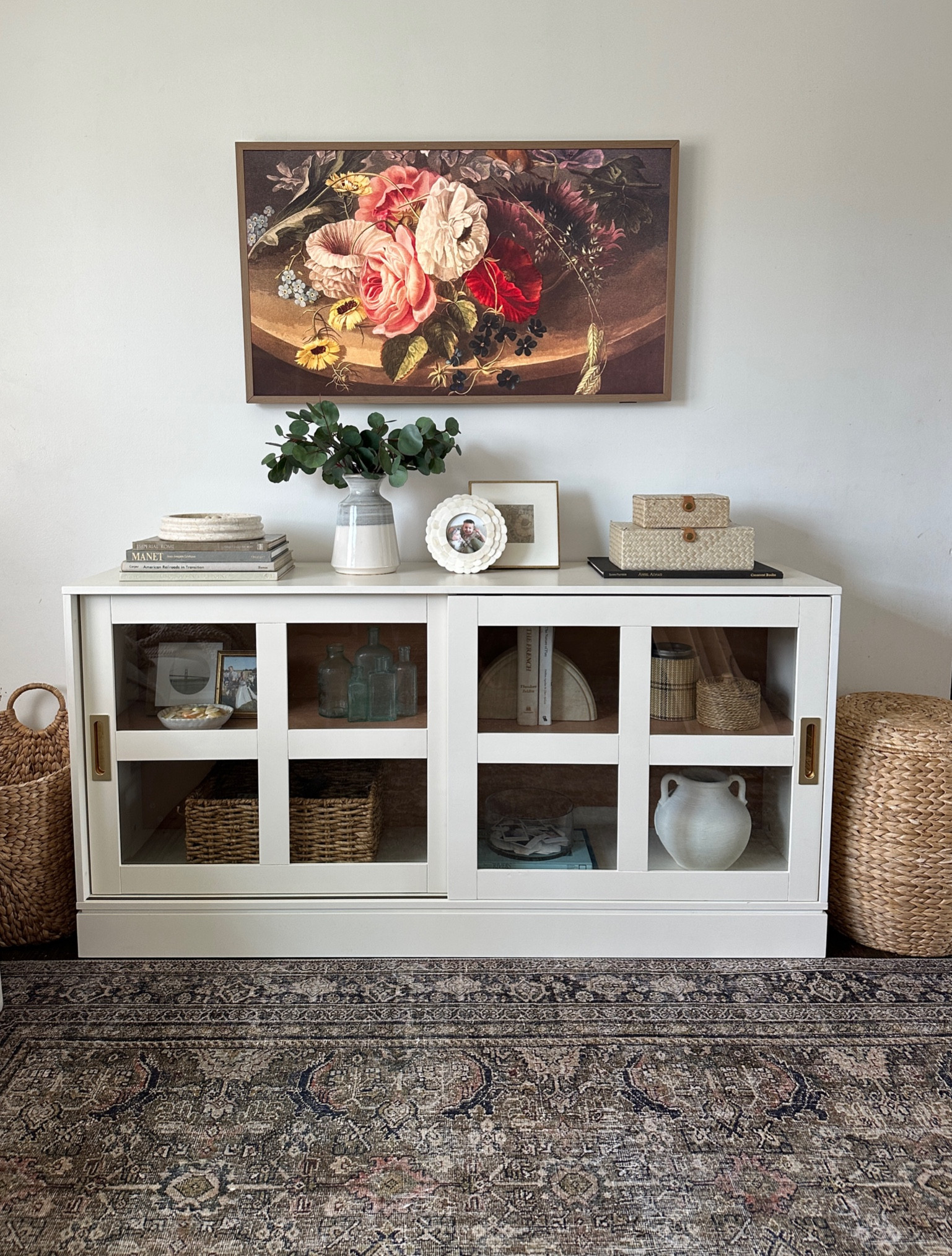 We finally have our tv stand spot . We have the 43 inch #frametv with the teak bezel frame . We’ve had it a couple years now and LOVE it. The tv stand is #target and i linked the decor i could. A lot of it is thrifted or older pieces no longer sold. 

#LTKunder50 #LTKsalealert #LTKhome