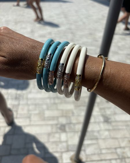 Budha bangles 
No sound bangles and waterproof 
Perfect for beach and pool days and travel 

#LTKFindsUnder100 #LTKSeasonal #LTKStyleTip