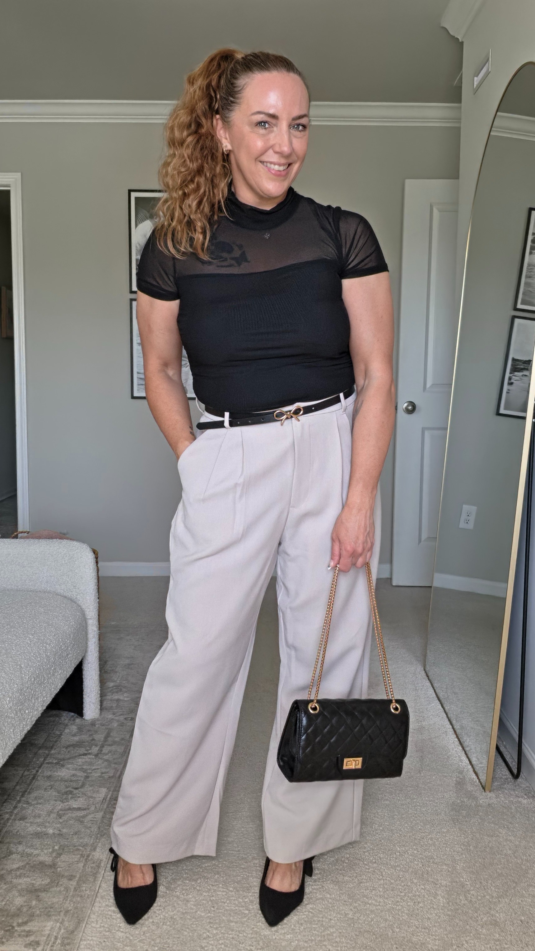 A black mock neck mesh top adds a modern edge to classic khaki tailored pants.#chicstyle #meshshirt #workwear #monochromelook

#LTKWorkwear #LTKOver40 #LTKgrwm