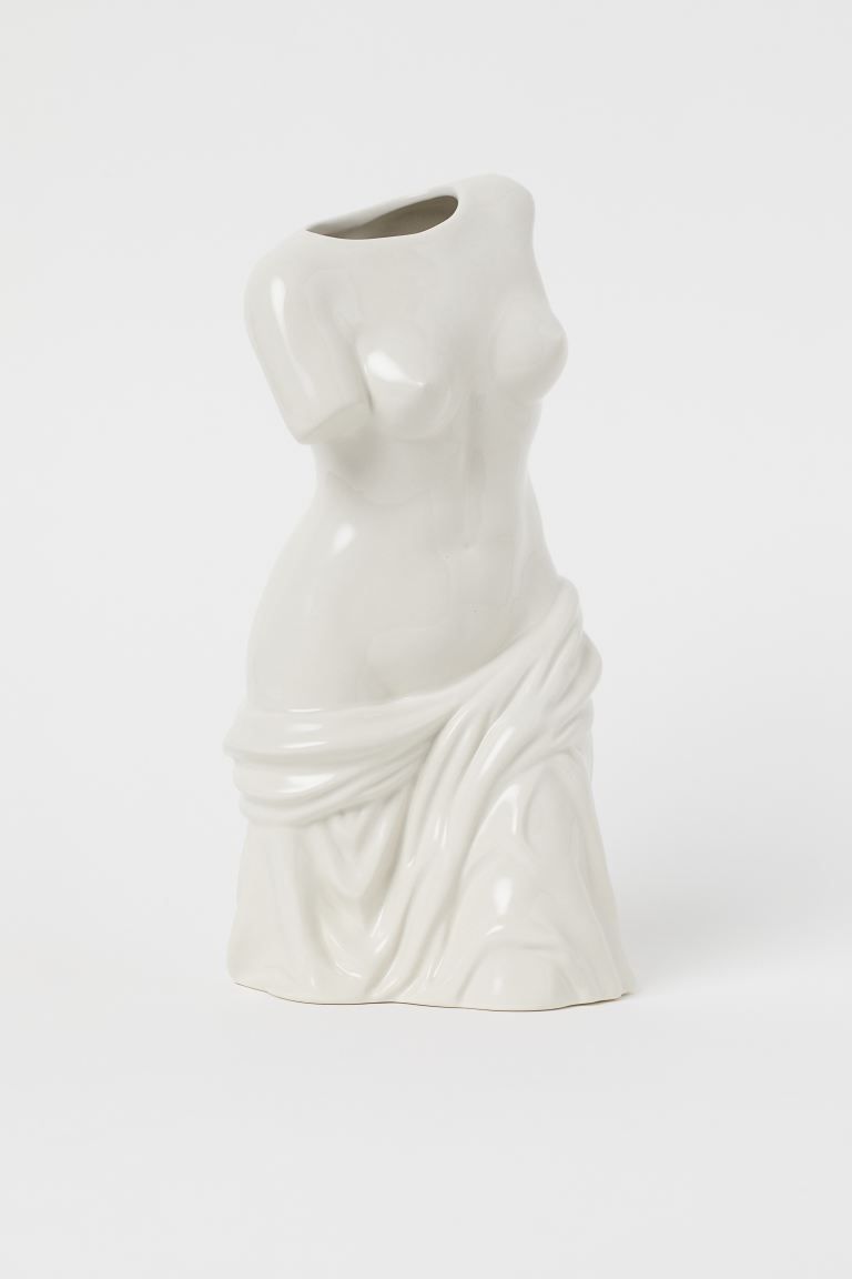 Torso-shaped vase in glazed stoneware. Width of opening 2 1/2 in. Width at base 5 in. Height 11 3... | H&M (US + CA)