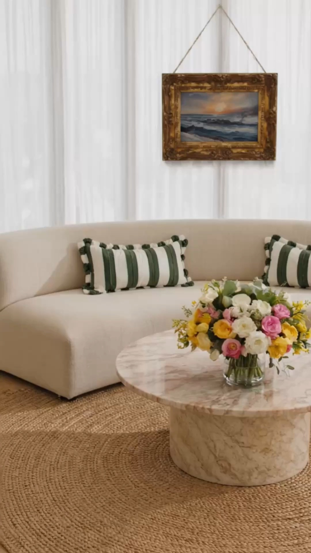 Morning light through crisp white sheers just hits differently ☀️  
A curved sofa, woven jute rug, marble coffee table, elegant floral arrangement, and layered art moment — soft, relaxed, and effortlessly elevated. Loving how the natural light slowly moves across the room and creates such a calm modern atmosphere.

#morninglight #sheerdrapes #curvedsofa #coffeetable #juterug #floralmoment #art #artwork #modernclassic #interiordesign #livingroominspo #marbletable #cozyhome #luxuryinteriors #neutralhome #eleganthome #homedecor

#LTKdayinmylife #LTKHome #LTKSaleAlert