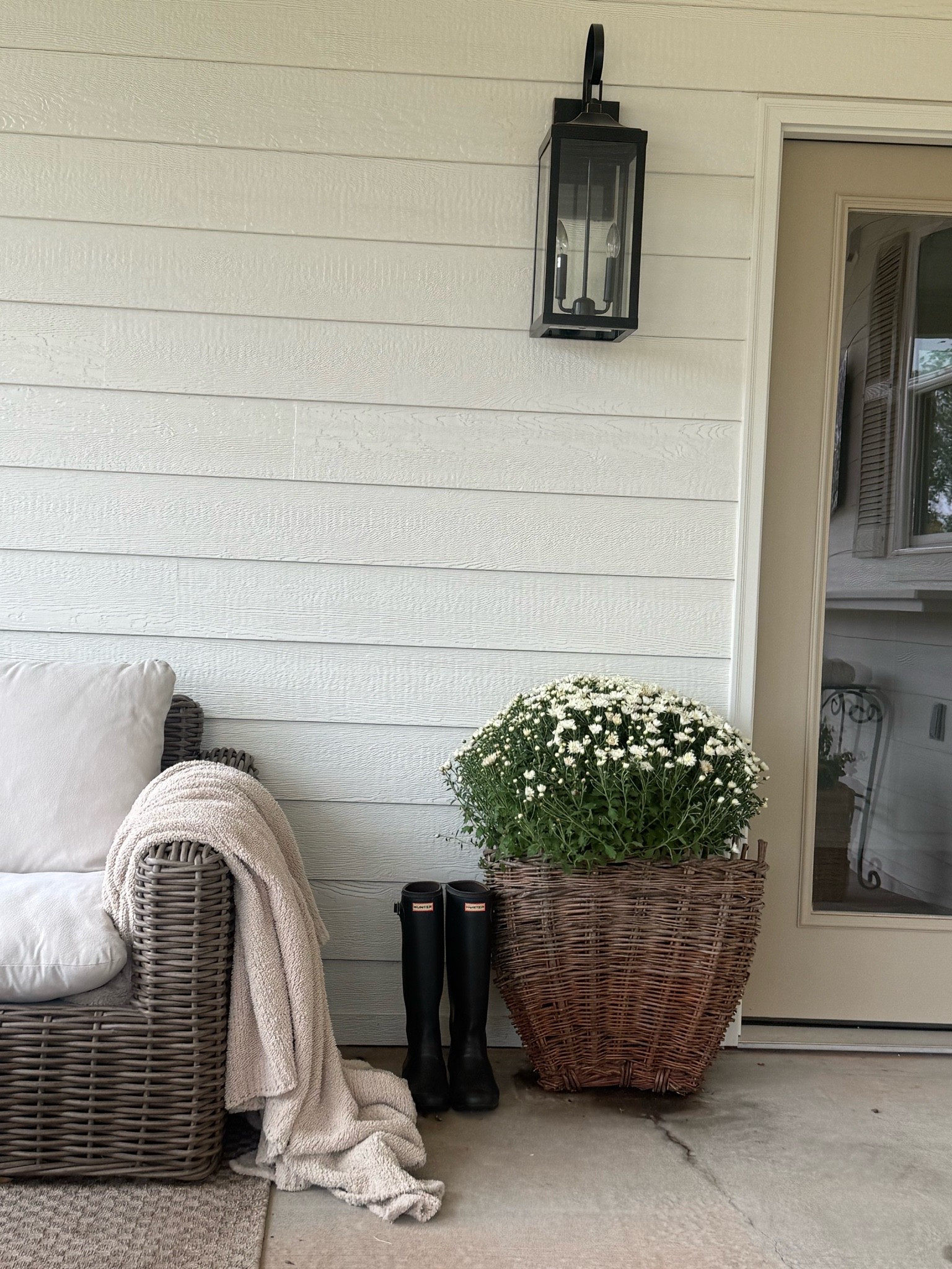 Simple fall look by the back porch door. Basket from @antiquefarmhouse - the couch is from Lowe’s and no longer sold. These lantern lights are also from @lowes and are large and super affordable for exterior lighting!

#LTKHome #LTKSeasonal