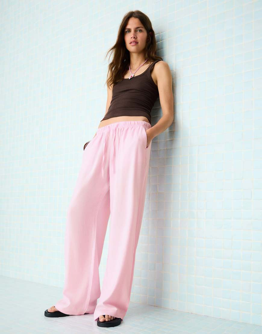 Bershka Linen blend trousers with an elasticated waistband in pink | ASOS (Global)
