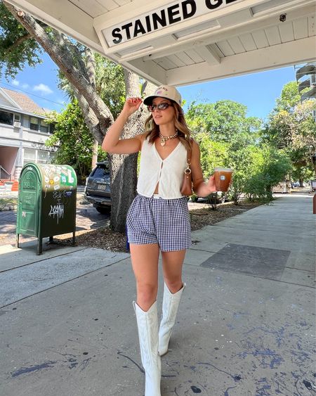5/7/24 Boxer shorts outfit 🫶🏼 boxer shorts, navy blue boxer shorts, gingham boxer shorts, vest top, sweater vest, summer outfits, summer fashion, summer fashion trends, trucker hat outfits, cowgirl boots, dolce vita cowgirl boots, dolce vita boots
