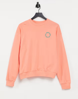 ASOS Weekend Collective oversized sweatshirt with tonal embroidery logo in coral | ASOS (Global)