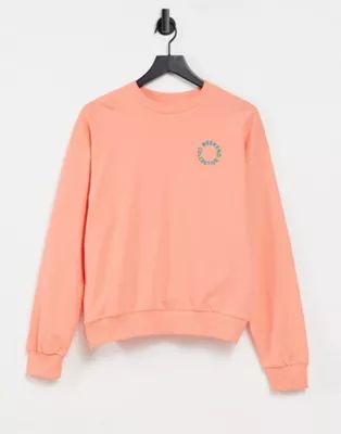 ASOS Weekend Collective oversized sweatshirt with tonal embroidery logo in coral | ASOS (Global)