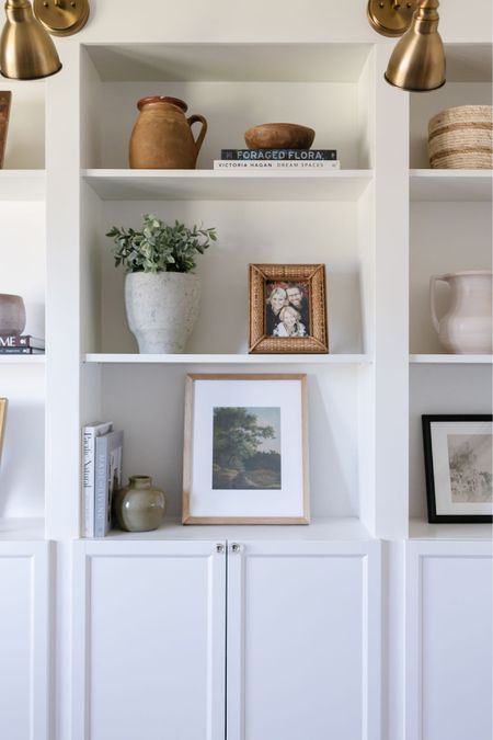 Shelf styling, artwork, wood gallery frames, vase 

#LTKstyletip #LTKhome #LTKfindsunder100