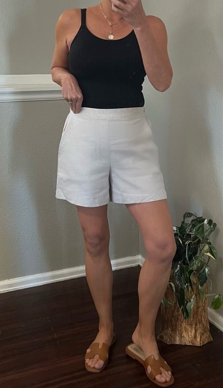 Linen shorts. These are SO good! A flat front and elastic back with side seam pockets! Linen blend and on sale for under $25 right now in cart. They come in 10 colors. They are true to size and I’m wearing a small. Cami is a large and sandals are tie to size.  #linenshorts #summeroutfit #shortsover40 #oufitidea

#LTKover40 #LTKfindsunder50 #LTKsalealert