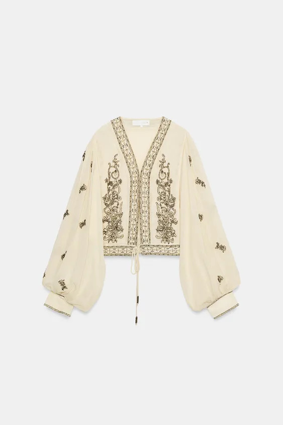 ZARA WOMAN COLLECTIONBlouse made from viscose yarn fabric. V-neckline and long puff sleeves with ... | Zara US