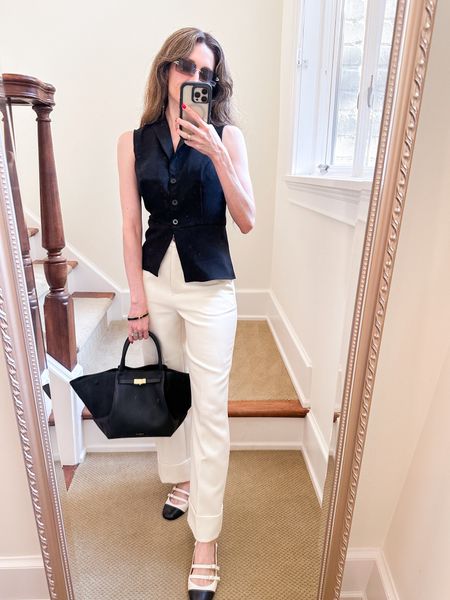 Black and white outfit for work featuring the vest and the white Damon trousers from Sezane and the perfect classic two tone Mary Janes, with a structured bag. Vest is 20% off with code ziba20

#LTKShoeCrush #LTKWorkwear #LTKSeasonal