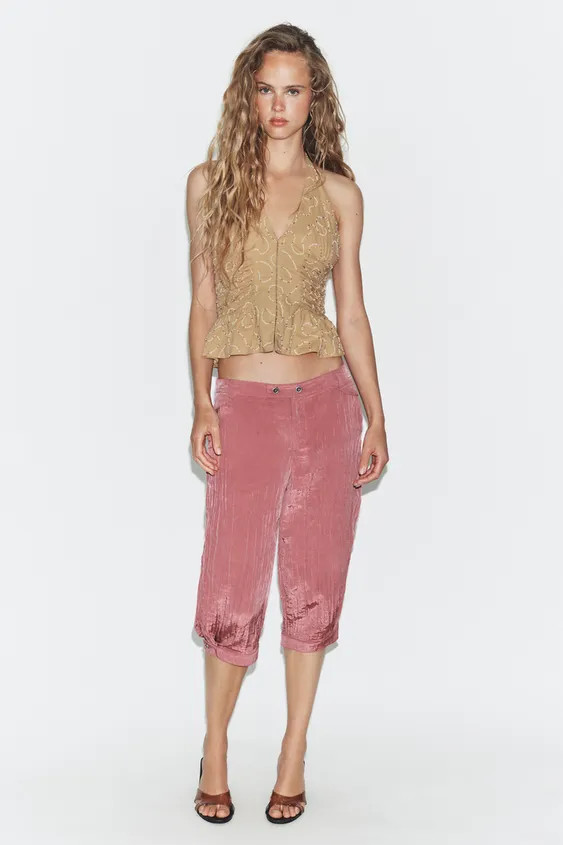 Halter neck top with a plunging v-neck. Featuring side gathering and contrast bead appliqués. Li... | Zara UK