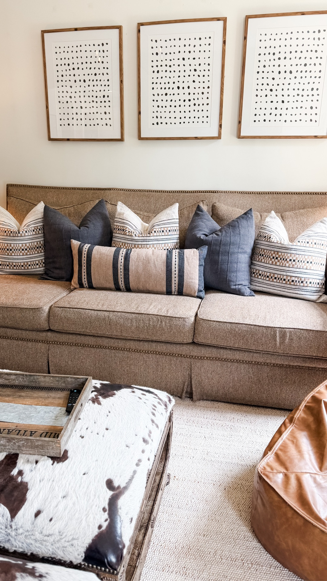 Love my target throw pillows! Cowhide ottomans were custom about 13 years ago

#LTKSeasonal #LTKHome