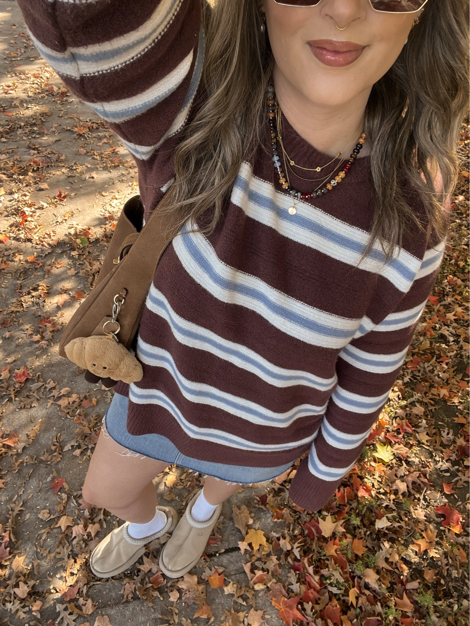 Casual fall outfit! Sized up to XL in the striped sweater for an oversized fit. I bought this Abercrombie denim skirt last year in a size 32, if I was repurchasing I would get a 30 or 31. I’m a 30 in their jeans! Ugg Tazz platforms are so comfy and TTS

#LTKfall #LTKstyletip