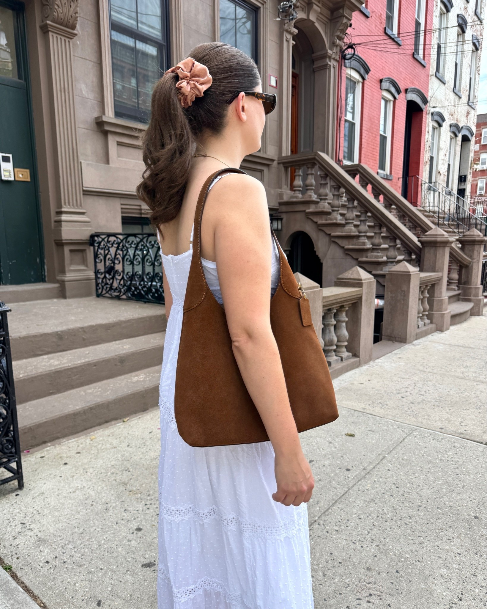 A simple white eyelet sundress is the perfect summer outfit. I paired this look with my suede bag from Coach and a big scrunchie. The flat sandals could be swapped for sneakers if you’re running errands.

#LTKootd