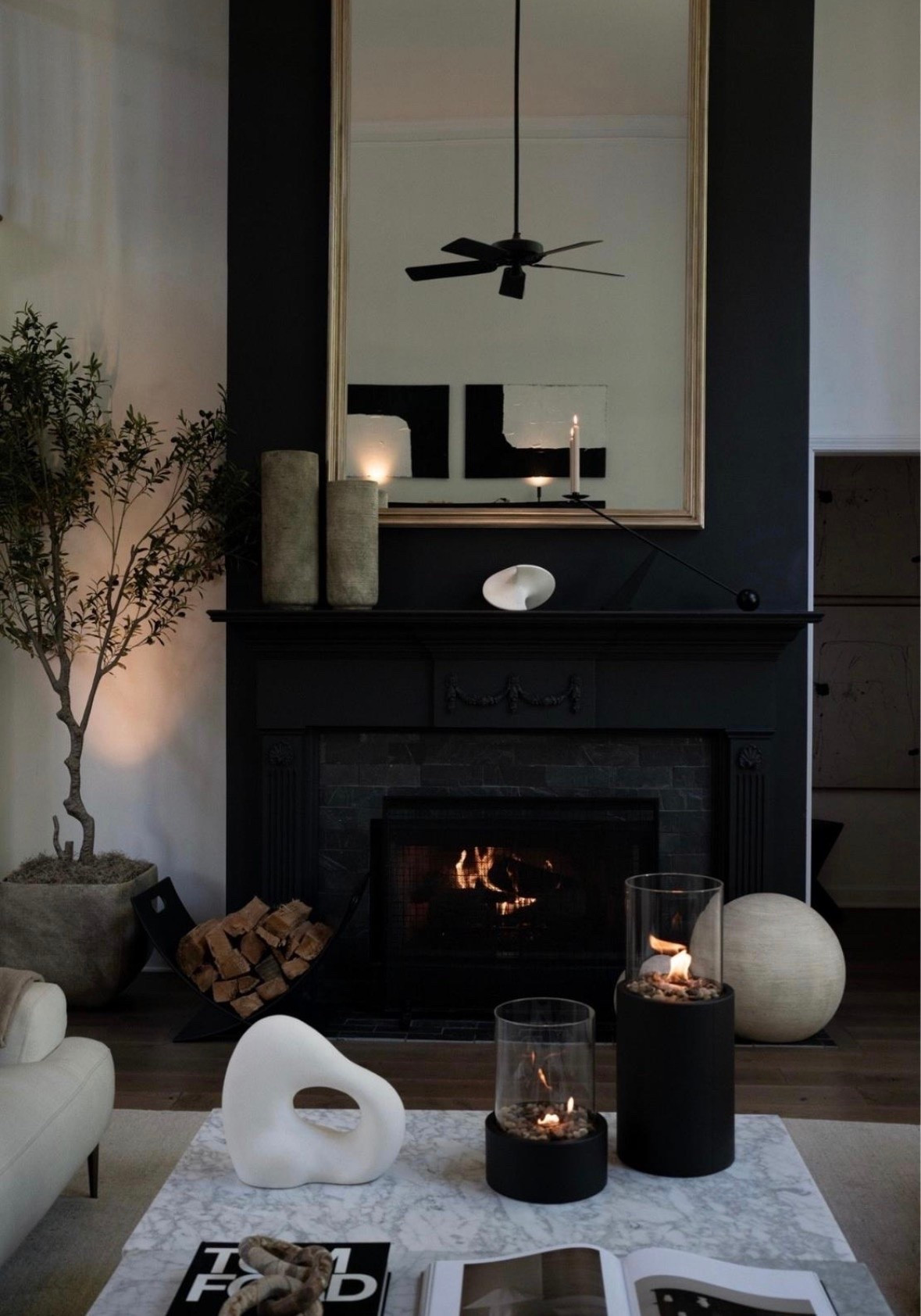 I’m absolutely loving the cozy vibes of this space! The flickering fireplace, the elegant candles, and that stunning sculptural art piece create the perfect atmosphere to unwind. Every detail, from the natural wood stack to the modern black mantle, brings warmth and style to my home. This is my sanctuary where comfort meets chic!

#LTKSeasonal #LTKHome #LTKSaleAlert