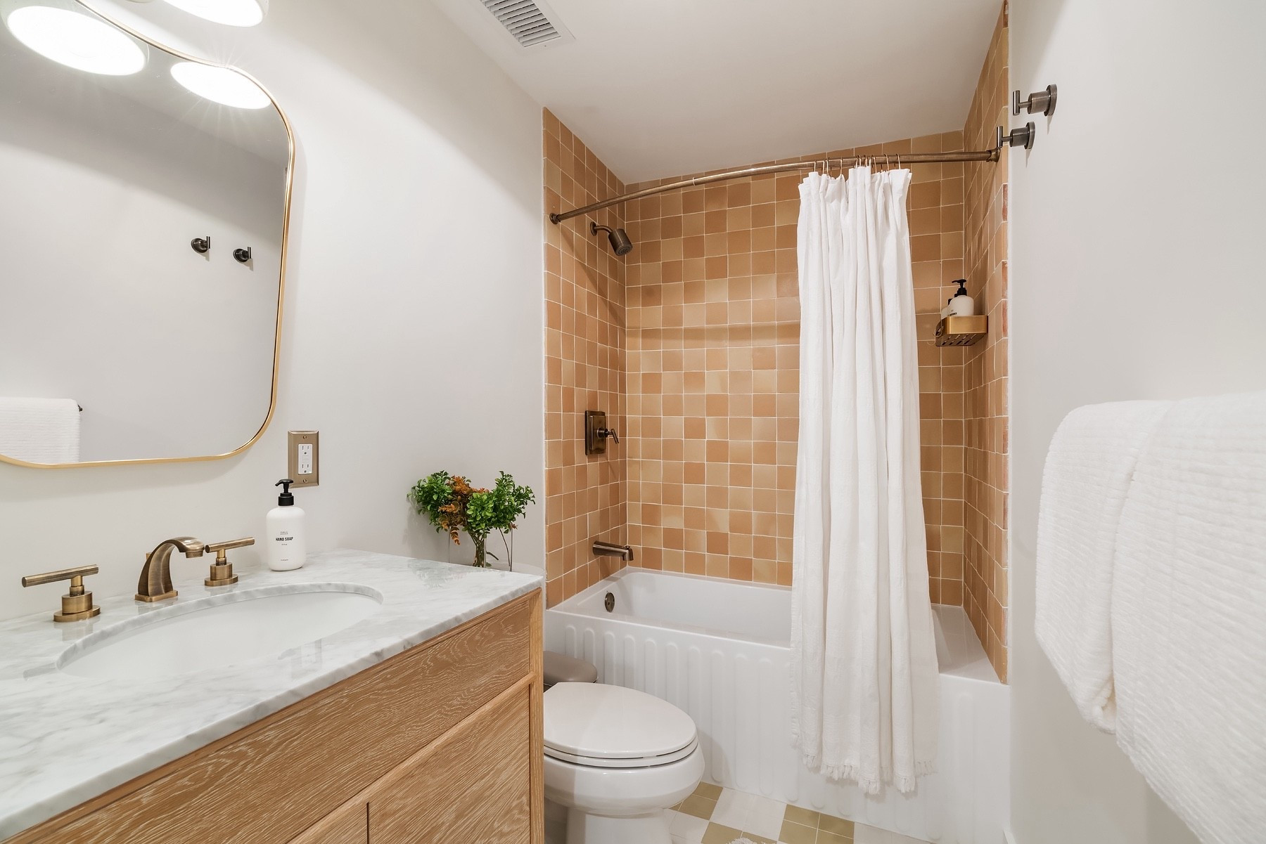 Neutral tile but with a pattern, mixed with wood and brass accents— the perfect combo for a calm, timeless bath. 🚿✨ 

 #bathroominspo #neutralhome #modernbathroom #homestyling #interiordesign #brassdetails #homefinds 

#LTKHome