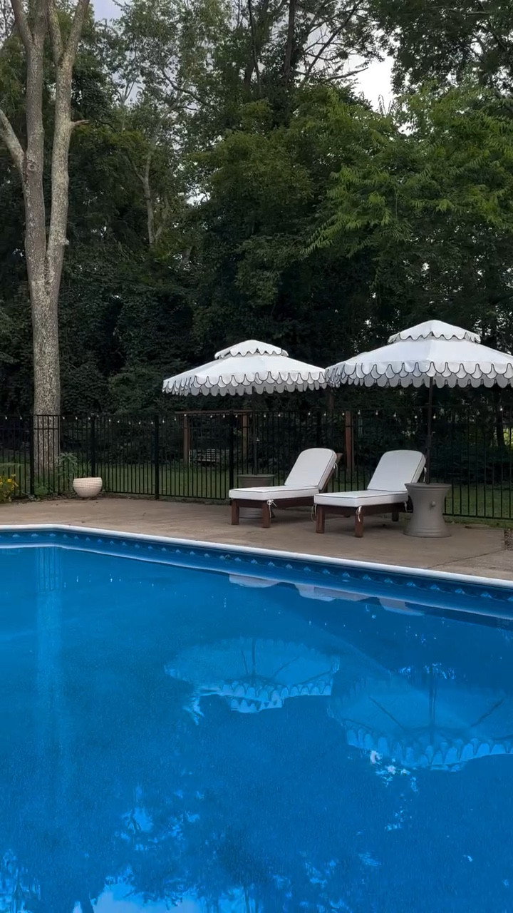 The resort called. I told them “I’m good.”

Just my opinion but I think we can make our backyards feel like our own resort. Two double valance scalloped umbrellas, matching side tables and chaise lounges have my pool patio feeling like the vacation I kept paying to go somewhere else for. The scallop detail is everything ✨

 These sell out every April without fail. You can find all my umbrella & pool patio picks below 🤍

#backyardinspo #poolseason #summerliving #outdoorfurniture #outdooroasis

#LTKHome